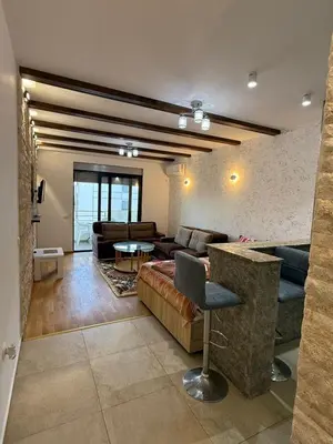 a living room with a couch and a table at Lindi in Ulcinj