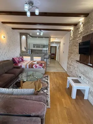 a living room with a couch and a table at Lindi in Ulcinj