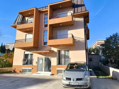 a car parked in front of a building at Stex Signature Central Point in Podgorica