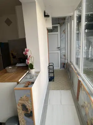 a hallway of a house with a door and a window at Apartman sa garažom in Sutomore