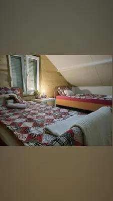 a bedroom with two beds in a attic at Village Drago in Cetinje