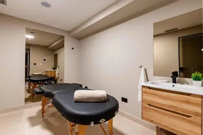 a black ottoman in a bathroom with a sink at Apartment Pržno See View in Pržno