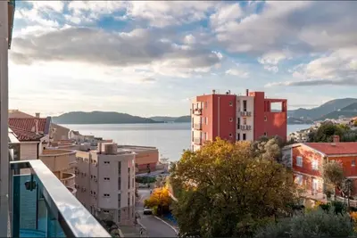 a view of a city with a large body of water at Apartment Pržno See View in Pržno