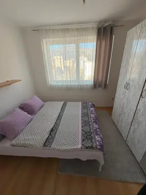 a bed in a room with a window at Bar Central Stay Apartment in Bar