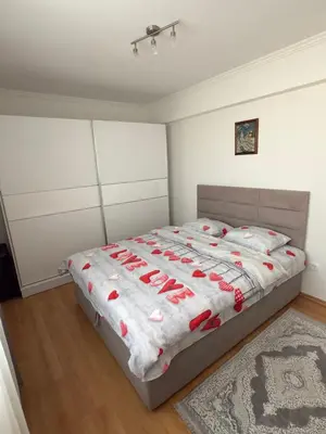 a bedroom with a bed with red shoes on it at Bar Central Stay Apartment in Bar