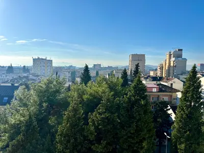 a view of a city with trees and buildings at Gorica Hill Luxury Residence in Podgorica