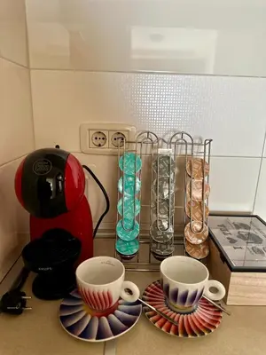 a kitchen counter with two cups and a blender at Gorica Hill Luxury Residence in Podgorica