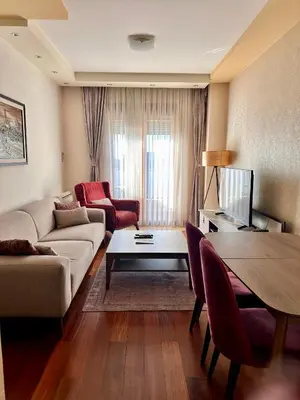 a living room with a couch and a table at Gorica Hill Luxury Residence in Podgorica