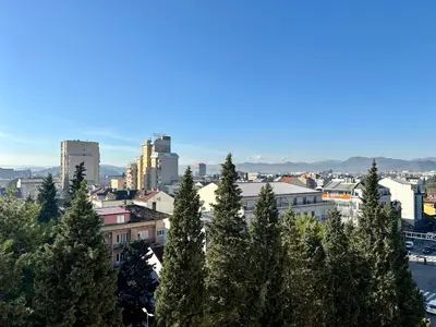 a view of a city with trees and buildings at Gorica Hill Luxury Residence in Podgorica