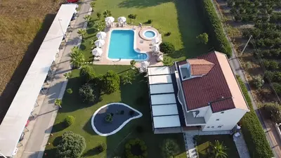 an overhead view of a house with a swimming pool at Resort Comfort - Long Beach in Ulcinj