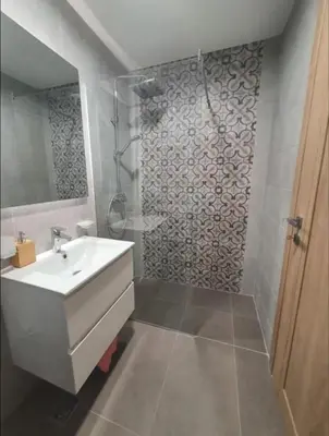a bathroom with a sink and a shower at Master Quart studio apartment in Podgorica