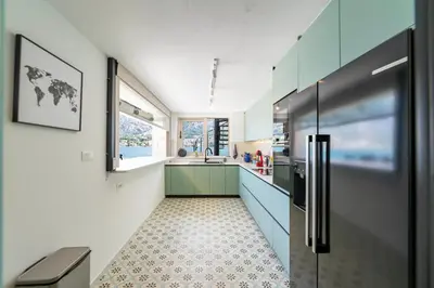a kitchen with a refrigerator and a sink at Seafront Kotor Bay View Villa NW in Muo