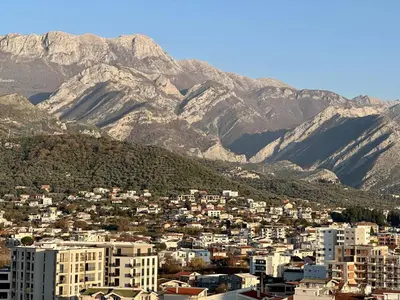a view of a city with mountains in the background at Alula Apartments in Bar