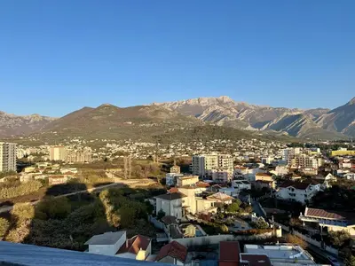 a view of a city with mountains in the background at Alula Apartments in Bar
