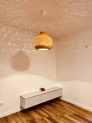 a white room with a table and a ceiling at Sunny Villas Luxury Apartment with Garden and Seaview in Katun