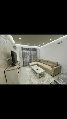 a living room with a couch and a coffee table at Garsonjera studio in Bar
