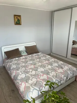 a bedroom with a bed and a window at Guest House Fenix