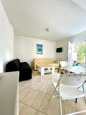 a living room with a couch and a table at Apartmane Đekovic in Ulcinj