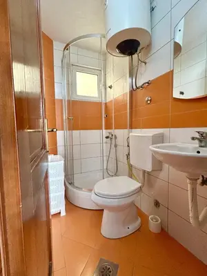 a bathroom with a toilet and a sink at Apartmane Đekovic in Ulcinj