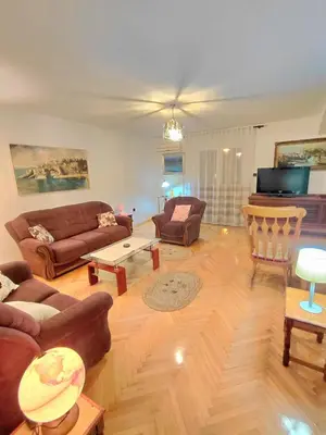 a living room with couches and a television at Apartment Maruni in Bar, Susanj