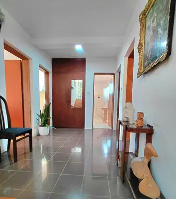 a living room with a hallway with a table and chairs at Apartment Maruni in Bar, Susanj