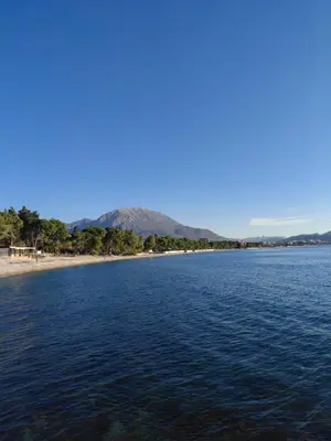 a large body of water with mountains in the background at Apartment Maruni in Bar, Susanj