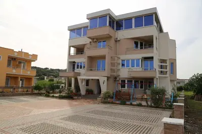 a large building with a lot of windows at REXHEPI Apartments in Ulcinj