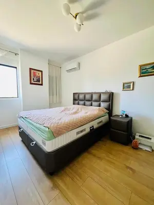 a bedroom with a large bed in a room at BAR - Jednosoban stan u centru in Bar