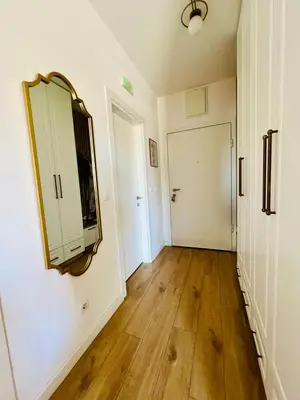 a room with a mirror on the wall and a hallway at BAR - Jednosoban stan u centru in Bar