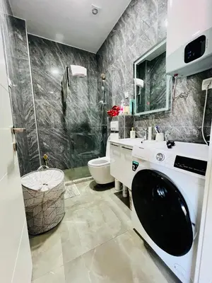 a bathroom with a shower and a toilet and a sink at BAR - Jednosoban stan u centru in Bar