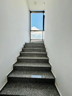 a staircase leading up to a window in a building at BAR - Jednosoban stan u centru in Bar