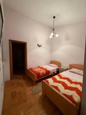 a room with two beds in a room at Vila Žuta in Bar