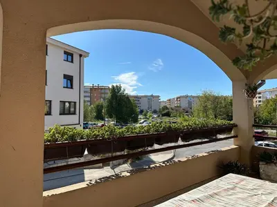 a balcony with a view of a building at City Big Apartman in Podgorica