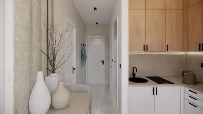 a kitchen with white cabinets and a white vase on a counter at Ramonda Villa&Pool in Buljarica