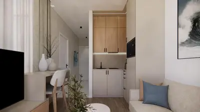 a living room with a couch and a kitchen at Ramonda Villa&Pool in Buljarica