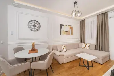 a living room with a couch and a table at Deluxe Apartment Zarah in Bar