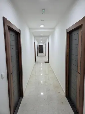a long corridor with two doors at Zara in Bar