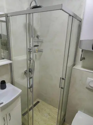 a shower with a glass door in a bathroom at Apartment Montenegro Becici in Becici