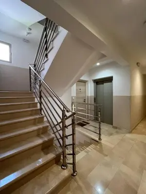 a staircase in a building with a stair railing at Apartment Montenegro Becici in Becici
