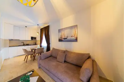 a living room with a couch and a table at Lamadu Residence in Sutomore