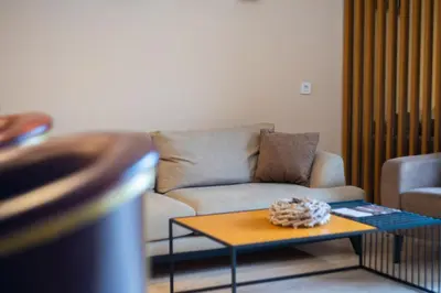 a living room with a couch and a coffee table at Lamadu Residence in Sutomore