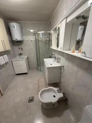 a bathroom with a toilet and a sink and a shower at 50 Shades of Blue in Ulcinj