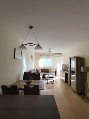 a living room with a couch and a table at Apartman City kvart Podgorica 2 in Podgorica