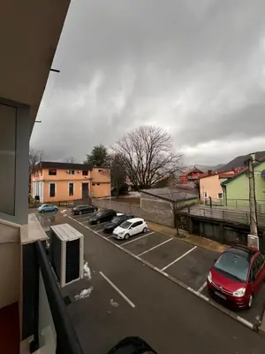 a view of a parking lot with cars parked at Apartman Luka in Cetinje