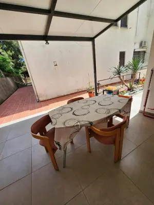 a table and chairs sitting on a patio at Inga - Apartment Ulcinj sea view in Ulcinj