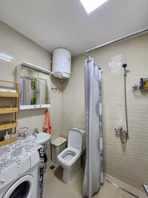a bathroom with a toilet and a sink and a shower at Inga - Apartment Ulcinj sea view in Ulcinj