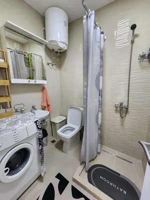 a bathroom with a toilet and a sink and a shower at Inga - Apartment Ulcinj sea view in Ulcinj