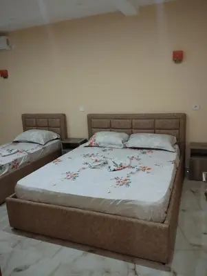 a bedroom with two beds in a room at Grandino rooms& apartments in Ulcinj