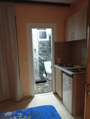 a bathroom with a toilet and a sink in a room at Grandino rooms& apartments in Ulcinj