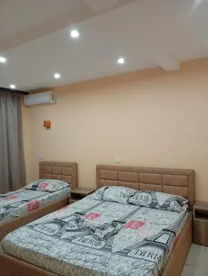 a bedroom with two beds in a room at Grandino Space room&apart Ulqin in Ulcinj